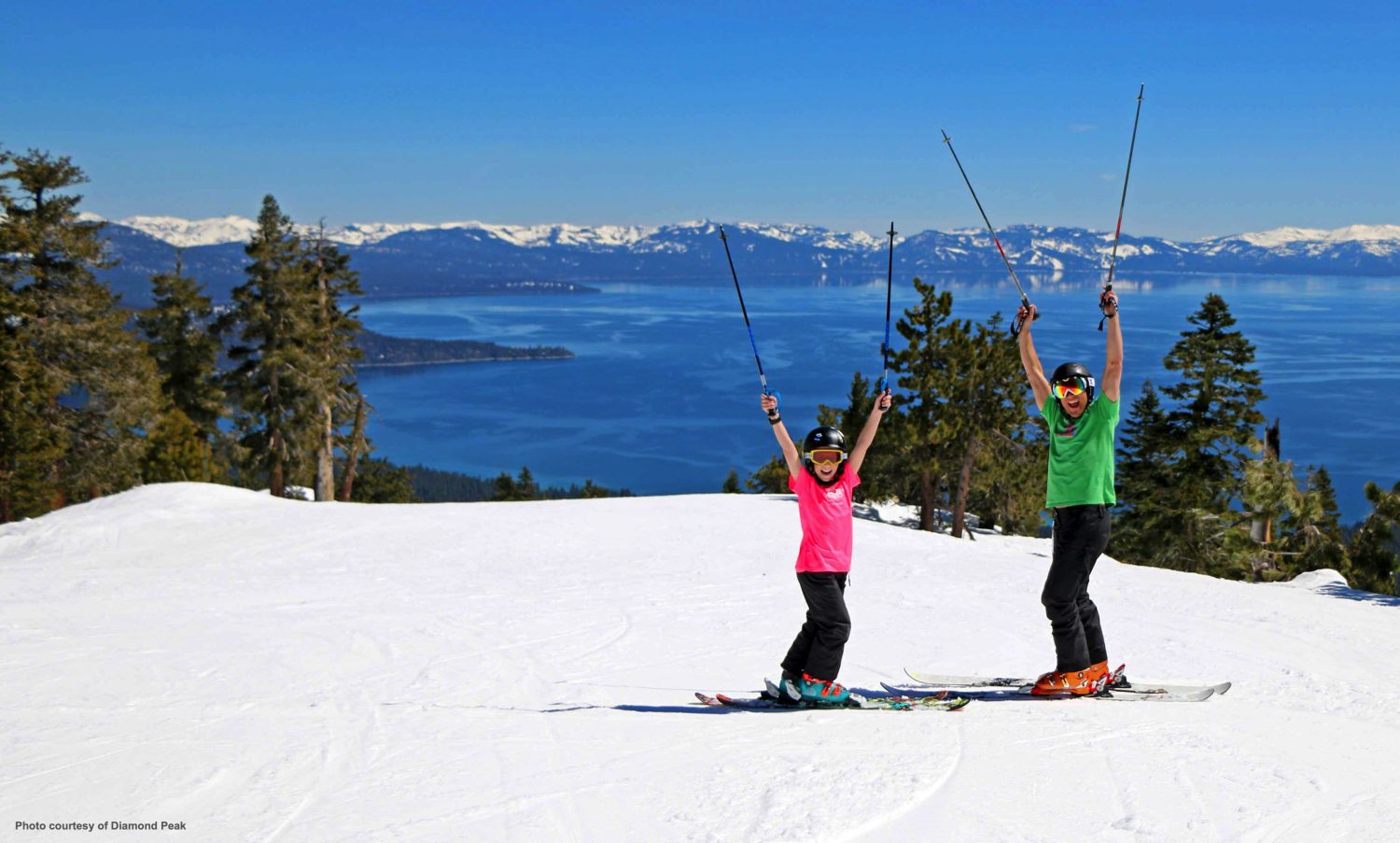 dad and son skiing during the sping in the tahoe lake area
